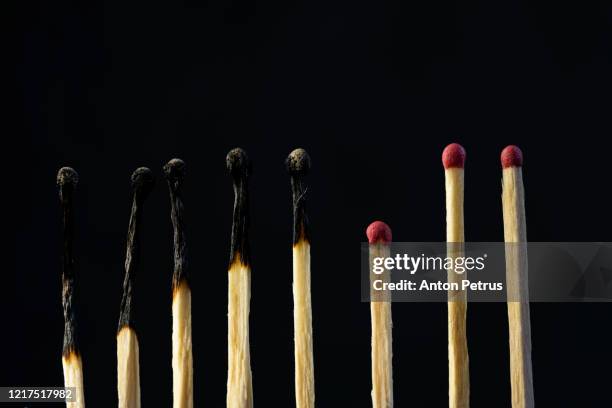 burning matches. concept of social distancing regarding coronavirus pandemic. - avoid danger stock pictures, royalty-free photos & images