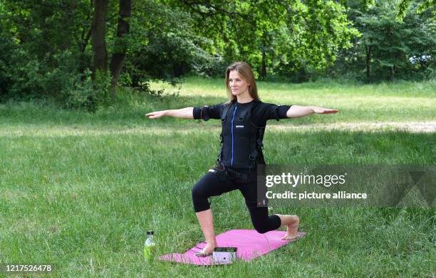 Actress Laura Preiss trains after her pregnancy with a mobile EMS device Roton Star, which enables her to train unattached and efficiently outside a...