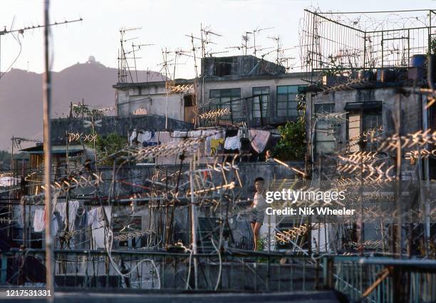 Kowloon walled City was a densely populated slum of high rise buildings with 50,000 people living on 6 acres near Kai Tak airport. It was demolished...