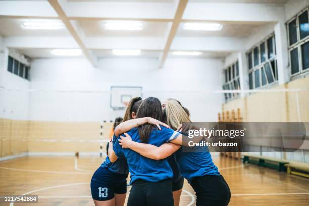 female volleyball team celebrating - sports team celebration stock pictures, royalty-free photos & images