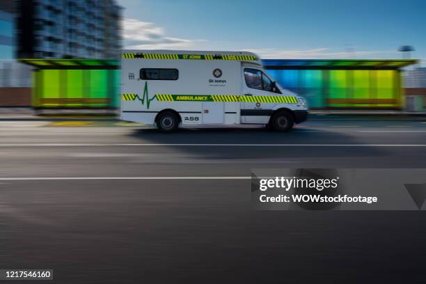 St. Johns ambulance passes in front of an empty bus stop on an unusually quiet Karangahape Road. On April 08, 2020 in Auckland, New Zealand. New...