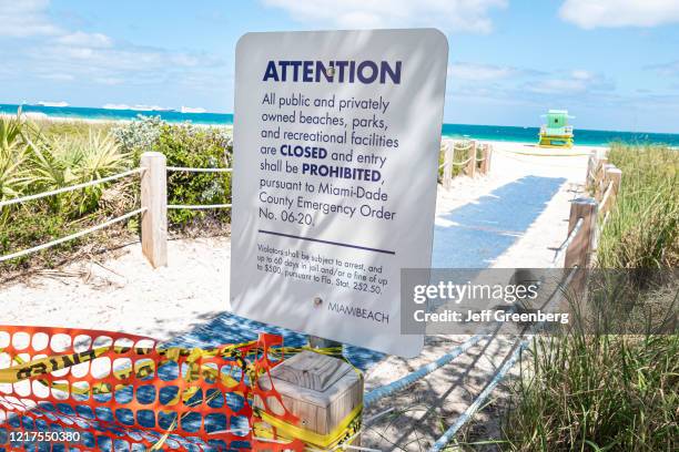 Miami Beach, South Beach, closed public beaches parks sign due to Coronavirus Pandemic.