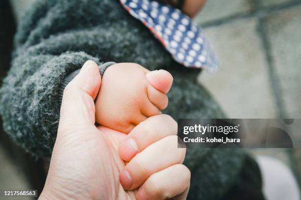 father and baby walking on the road - baby on the move stock pictures, royalty-free photos & images