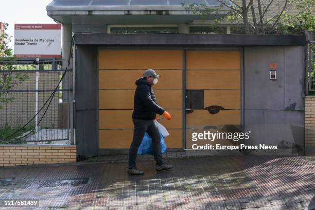Worker is seen as a farmer on his tractor disinfects the nursing home Madre Teresa at the town of Aranjuez, to fight against the coronavirus crisis...