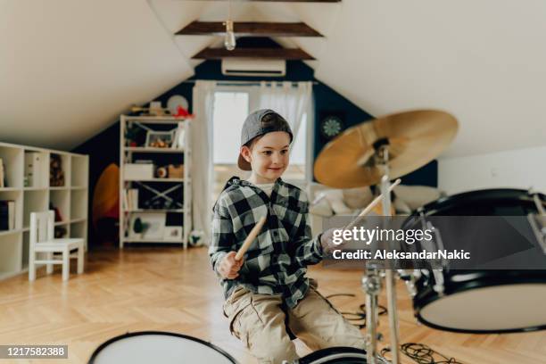 little boy playing drums - epidemic sound stock pictures, royalty-free photos & images