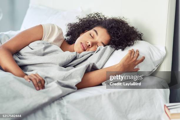 there's no time like nap time - woman in bed stock pictures, royalty-free photos & images