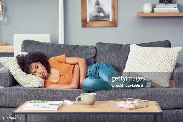 the once a month battle with your body - flat abs woman stock pictures, royalty-free photos & images