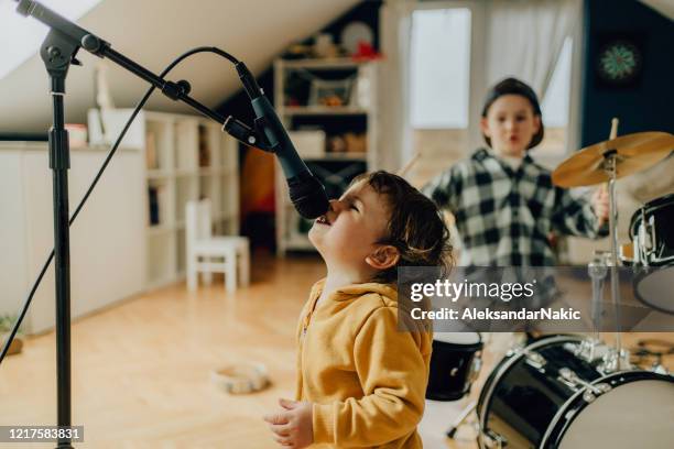 little musicians - toddler musical instrument stock pictures, royalty-free photos & images