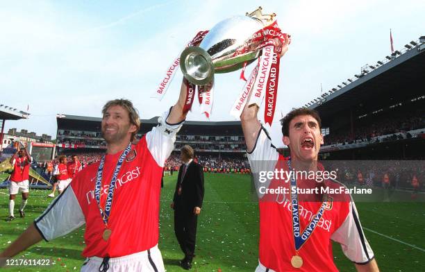 Tony Adams and Martin Keown of Arsenal with the Premier League trophy after the match between Arsenal and Everton on May 11, 2002 in London, England.