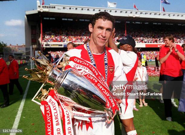 Martin Keown of Arsenal with the Premier League Trophy after the Premier League match between Arsenal and Leicester City on May 15, 2004 in London,...