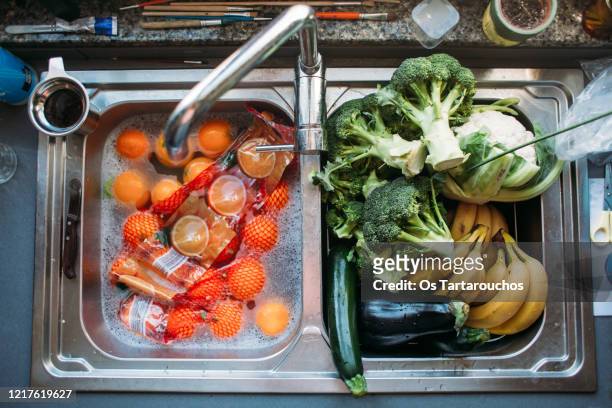 disinfecting groceries - infectious disease no people stock pictures, royalty-free photos & images
