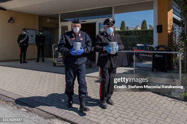 The Carabinieri take away from the crematorium the cinerary urns of the deceased of Bergamo, that they have to bring back to Bergamo for the families...