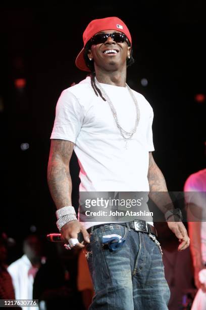 Rapper, Dwayne Michael Carter Jr., better known by his stage name Lil Wayne, is shown performing on stage during a "live" concert appearance on June...
