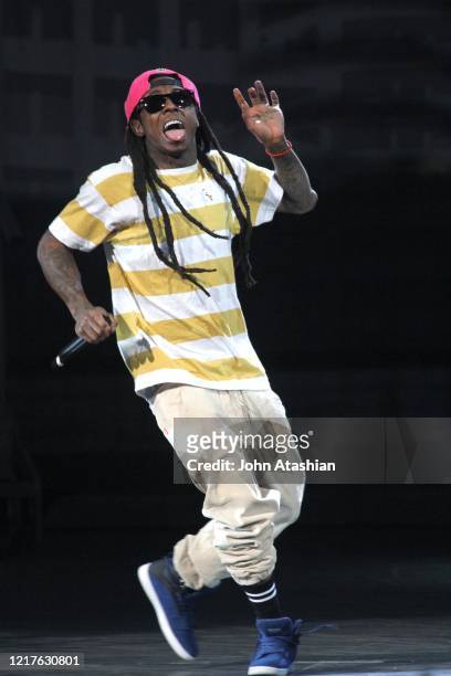 Rapper, Dwayne Michael Carter Jr., better known by his stage name Lil Wayne, is shown performing on stage during a "live" concert appearance on July...