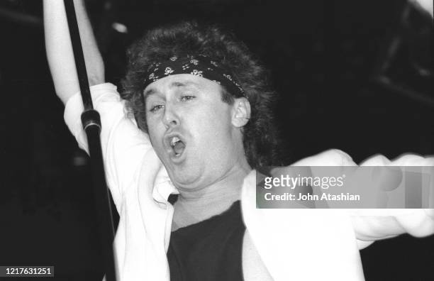 Singer Mike Reno is shown performing on stage during a "live" concert appearance with Loverboy on February 21, 1986.