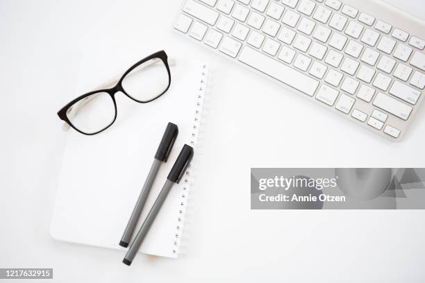 office desk top - notepad white table foto e immagini stock