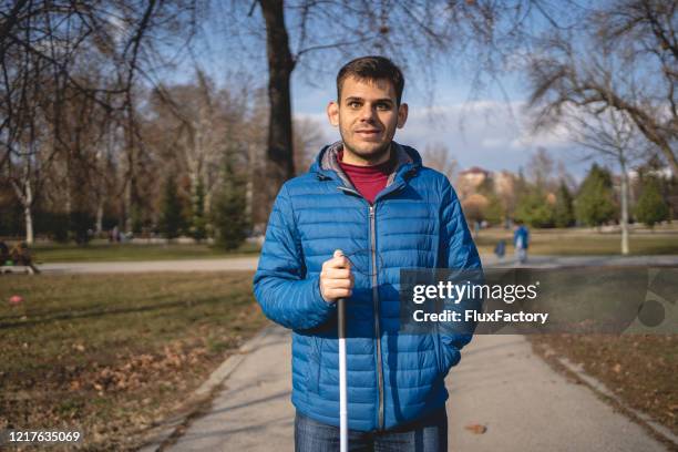 cheerful young man with visually impairment enjoying sunny day - blind person stock pictures, royalty-free photos & images