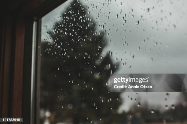 rain drop covered window - bad weather on window stock pictures, royalty-free photos & images
