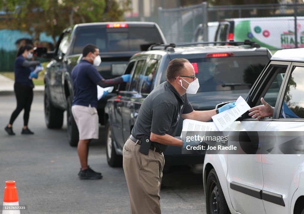 People Line Up For Unemployment Applications In Hialeah, FL During COVID-19 Crisis