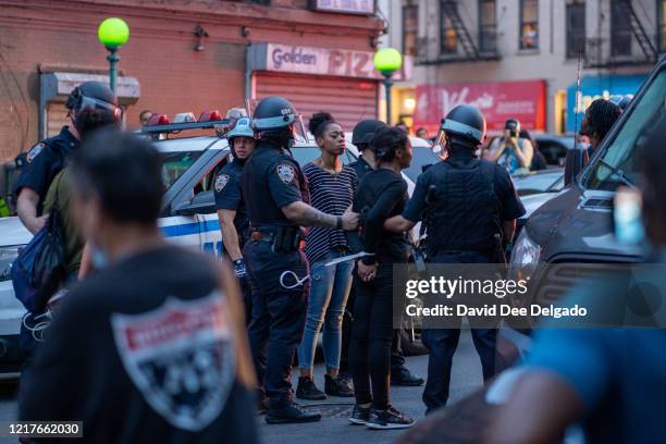 Arrest protesters for breaking the citywide 8:00PM curfew on June 4, 2020 in the Bronx borough of New York City. Widespread protests continue around...