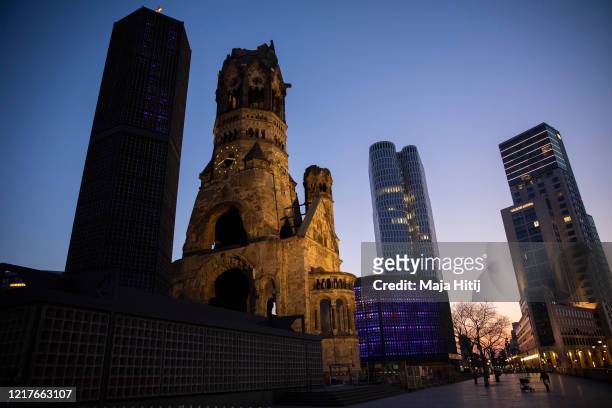 Few people hang out at Breitscheidplatz next to Kaiser Wilhelm Memorial Church on April 08, 2020 in Berlin, Germany. The number of confirmed...