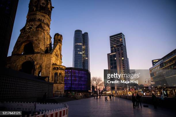 Few people hang out at Breitscheidplatz next to Kaiser Wilhelm Memorial Church on April 08, 2020 in Berlin, Germany. The number of confirmed...