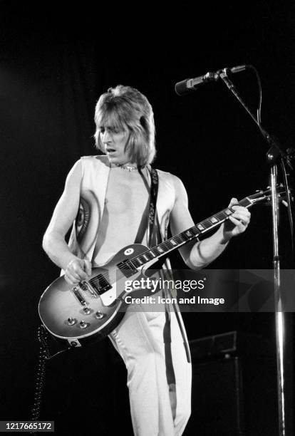 English guitarist, songwriter, producer and member of David Bowie's Spiders from Mars, Mick Ronson performs as a member of Mott The Hoople at the...