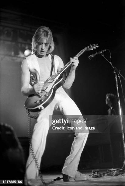 English guitarist, songwriter, producer and member of David Bowie's Spiders from Mars, Mick Ronson performs as a member of Mott The Hoople at the...