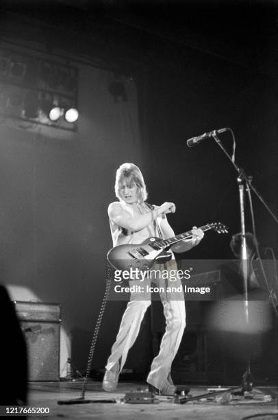 English guitarist, songwriter, producer and member of David Bowie's Spiders from Mars, Mick Ronson performs as a member of Mott The Hoople at the...
