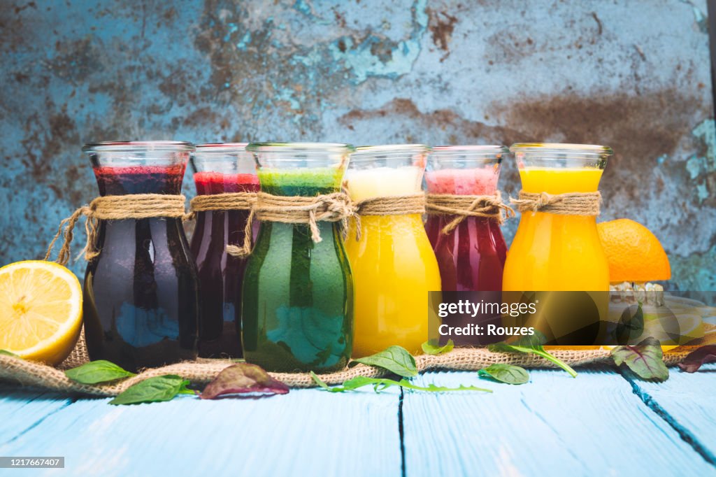 Various smoothies in a jar and ingredients