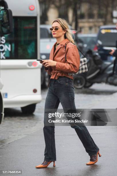 Digital influencer Anne Laure Mais wears Jonathan Simkhai jacket, Levis jeans, Manu Atelier shoes on February 27, 2020 in Paris, France.