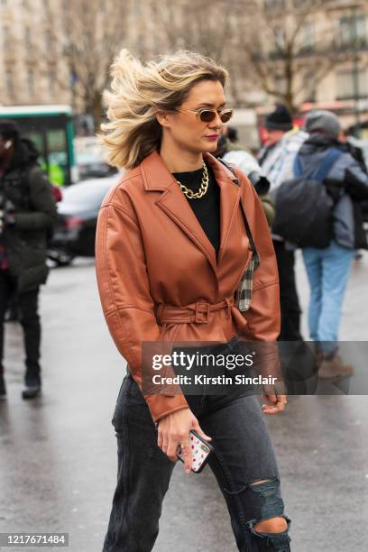 Digital influencer Anne Laure Mais wears Jonathan Simkhai jacket, Levis jeans on February 27, 2020 in Paris, France.