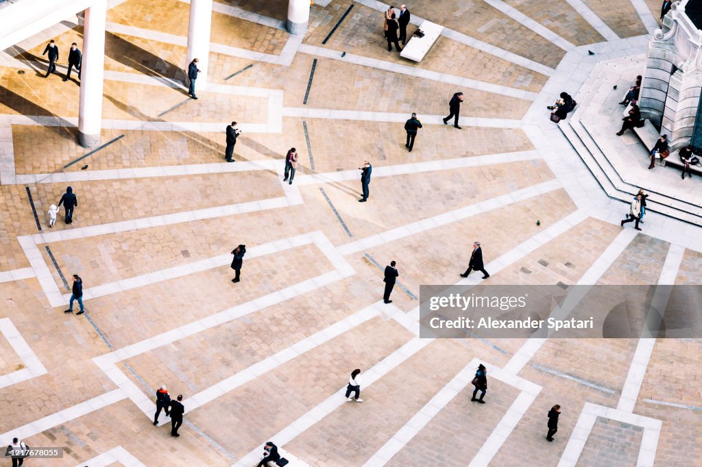 Aerial view of people walking on the town square