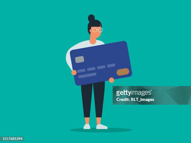 illustration von jungen frau mit riesigen kreditkarte - credit card stock-grafiken, -clipart, -cartoons und -symbole