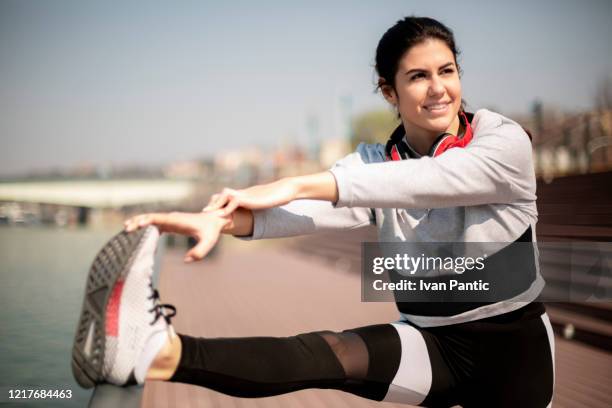 young fit woman exercising - calf human leg stock pictures, royalty-free photos & images