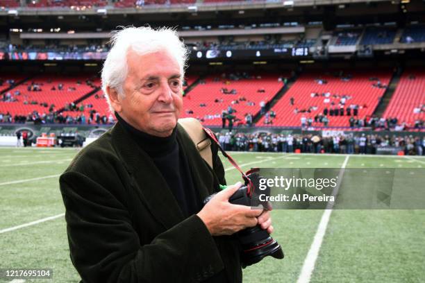 Photographer Harry Benson takes photographs on the sideline of the Jacksonville Jaguars vs. New York Jets game at Giants Stadium on November 15, 2009...