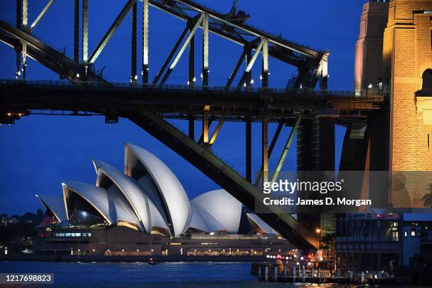 The Sydney Harbour Bridge and Opera House at night on April 08, 2020 in Sydney, Australia.
