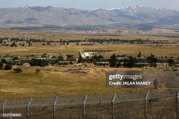 This picture taken from the Israeli-annexed Golan Heights on June 5, 2020 shows the border fence with the south-western Syrian governorate of...