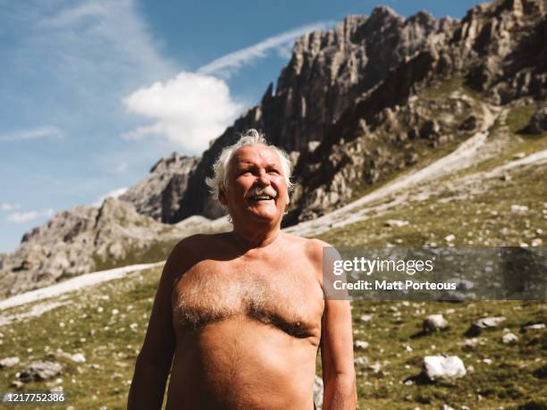 senior gent looking into the distance with beautiful mountain views - bar överkropp bildbanksfoton och bilder