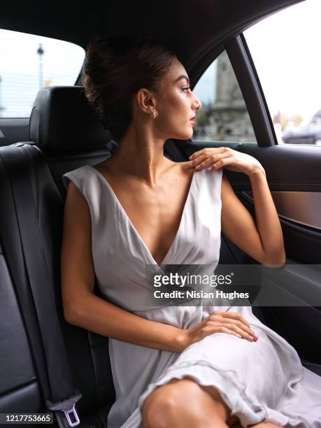 stylish young women in back seat of car, daytime - neckline stock pictures, royalty-free photos & images