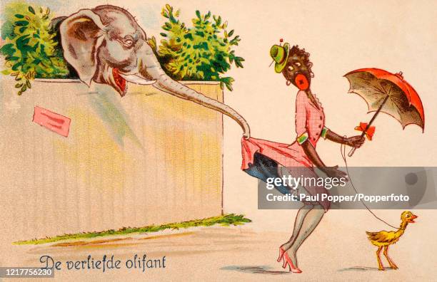 Vintage postcard illustration featuring a racist caricature of a black woman, having her skirt lifted by an elephant, published in Amsterdam, circa...