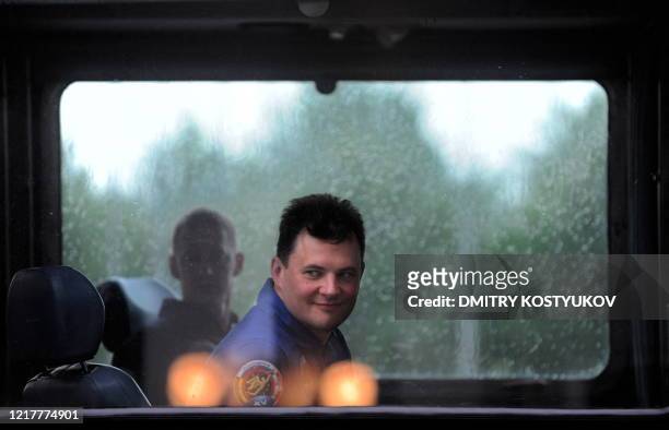 Russian cosmonaut Roman Romanenko sits in a bus after training at the Russian-leased Baikonur cosmodrome in Kazakhstan on May 23, 2009. The crew is...