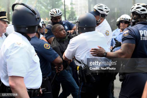 Protestors clash with police near City Hall, in Philadelphia, PA on May 30, 2020. Protestors clash with police in cities around the nation when...