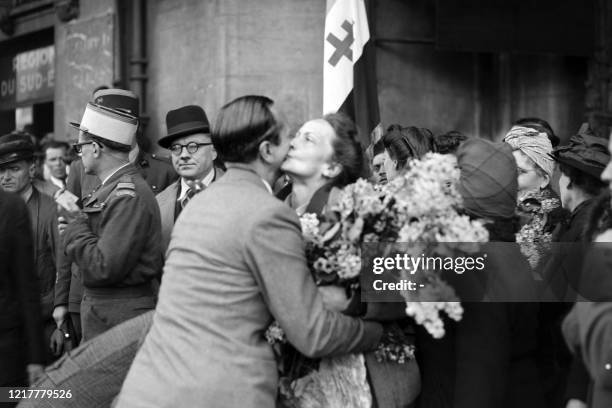 Former deported women, survivors of extermination camps, are welcomed at a reception center for deported women in April 1945 in Paris, at the end of...