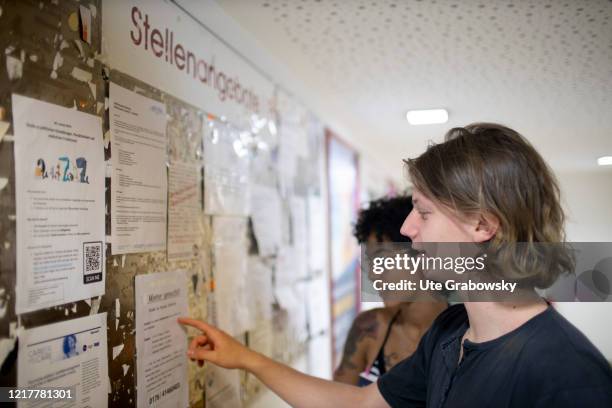 Side job wanted. Students looking at a board at the university of Bobb in times of corona pandemic on May 29, 2020 in Bonn, Germany.