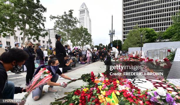 Roses are placed in front of the Hall of Justice in Los Angeles, California, on June 5, 2020 in solidarity with victims of alleged state violence...