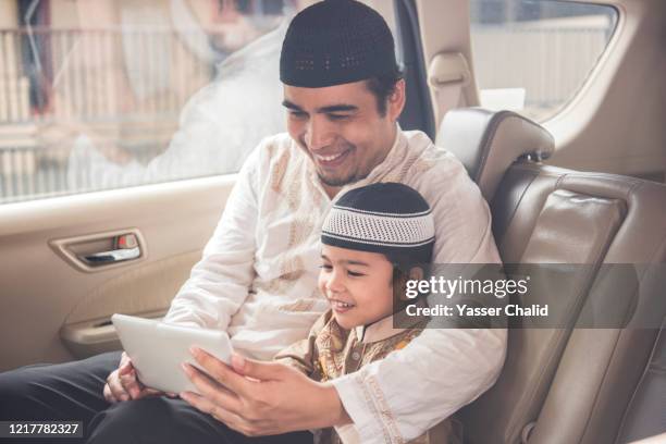 father and son in a car