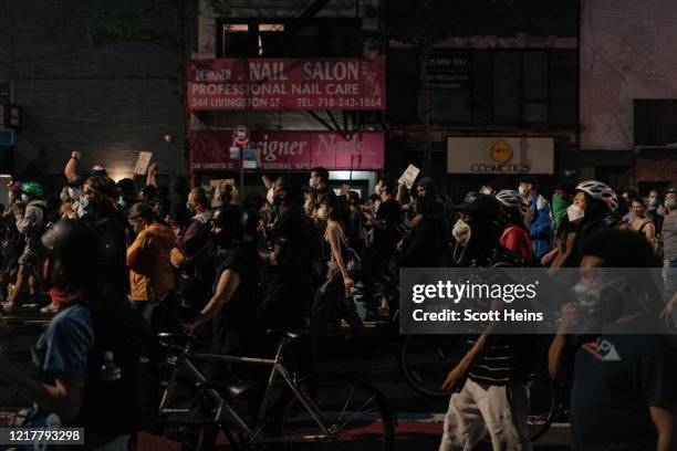 Protesters denouncing systemic racism in law enforcement march in defiance of a citywide curfew on June 5, 2020 in New York City. Days of protest,...