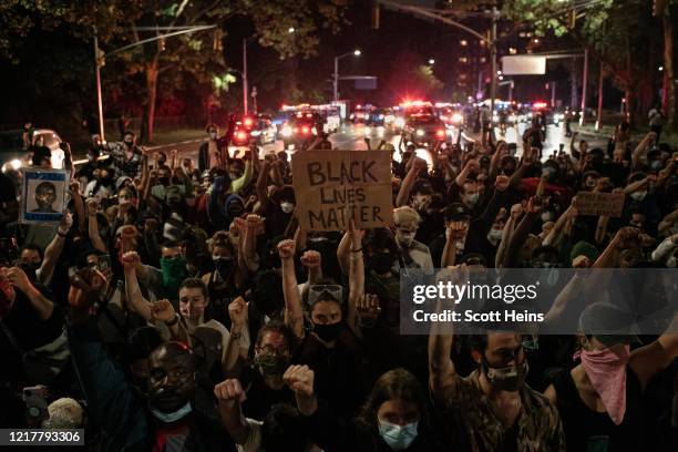 Protesters denouncing systemic racism in law enforcement march in defiance of a citywide curfew on June 5, 2020 in New York City. Days of protest,...
