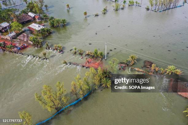 Flooded areas after the landfall of cyclone Amphan during the aftermath. Thousands of shrimp enclosures have been washed away, while numerous...